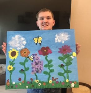 Student with his art at Starry Starry Night